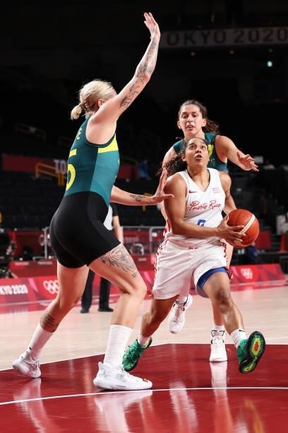 Jennifer O'Neill of Team Puerto Rico drives to the basket against Cayla George of Team Australia during the 2nd half of a Women's Basketball...