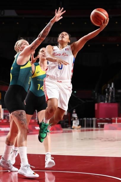 Jennifer O'Neill of Team Puerto Rico drives to the basket against Cayla George of Team Australia during the 2nd half of a Women's Basketball...