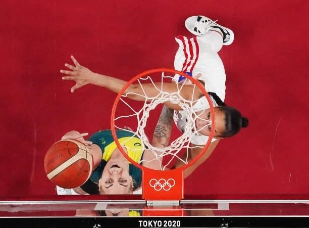 Cayla George of Team Australia drives to the basket against Tayra Melendez of Team Puerto Rico during the 2nd half of a Women's Basketball...