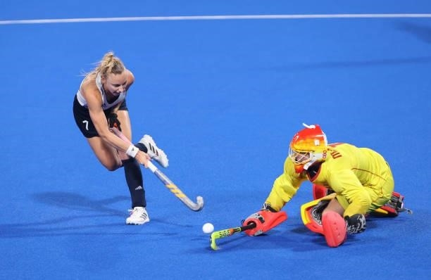 Hannah Martin of Team Great Britain scores her team's second penalty in the penalty shootout past Maria de los Angeles Ruiz Castillo of Team Spain...