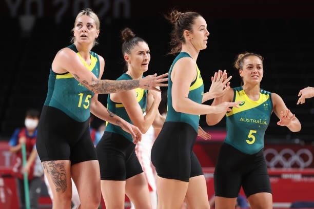 Cayla George, Katie Ebzery Jenna O'Hea, and Leilani Mitchell of Team Australia high-five one another during the 2nd half of their Women's Basketball...
