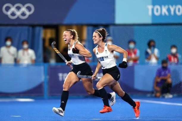Hannah Martin and Anna-Frances Toman of Team Great Britain celebrate victory in the Women's Quarterfinal match between Spain and Great Britain on day...