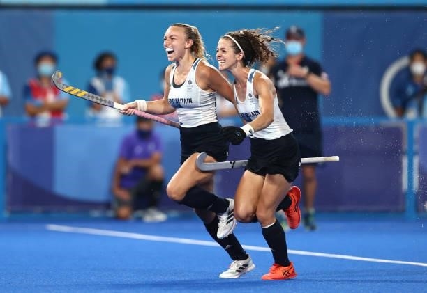 Hannah Martin and Anna-Frances Toman of Team Great Britain celebrate victory in the Women's Quarterfinal match between Spain and Great Britain on day...