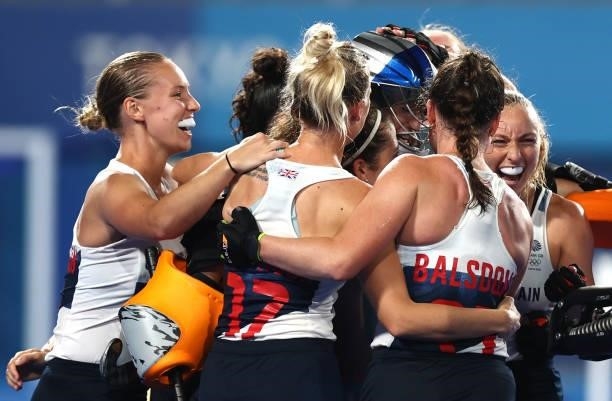 Madeleine Claire Hinch of Team Great Britain celebrates with teammates following victory in the penalty shootout during the Women's Quarterfinal...