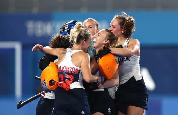 Madeleine Claire Hinch of Team Great Britain celebrates with teammates following victory in the penalty shootout during the Women's Quarterfinal...