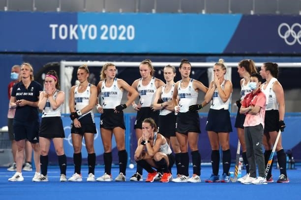 Team Great Britain looks on whilst awaiting a video referral decision of Team Spain's fourth penalty during the Women's Quarterfinal match between...
