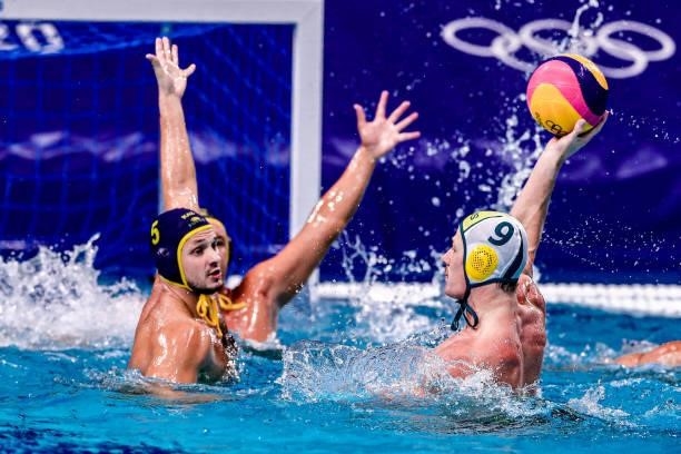 Aleksey Shmider of Kazakhstan, Andrew Ford of Team Australia during the Tokyo 2020 Olympic Waterpolo Tournament Men match between Team Australia and...