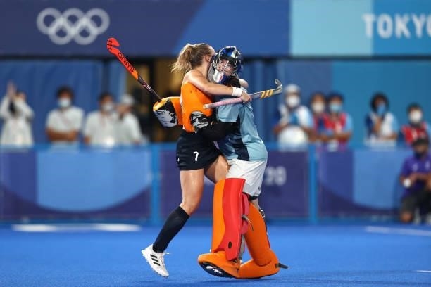 Hannah Martin of Team Great Britain and teammate Madeleine Claire Hinch celebrate victory in the Women's Quarterfinal match between Spain and Great...