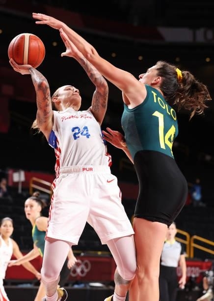 Jazmon Gwathmey of Team Puerto Rico drives to the basket against Marianna Tolo of Team Australia during the 2nd half of a Women's Basketball...
