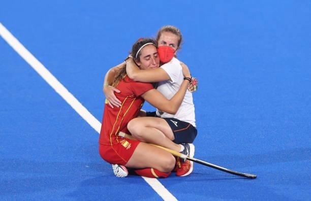Julia Pons Genesca of Team Spain is consoled by a Staff Member of Team Spain following a loss in the Women's Quarterfinal match between Spain and...