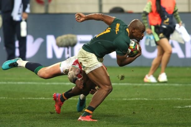 Makazole Mapimpi of South Africa attempts to slip Stuart Hogg of the British & Irish Lions tackle during the second test between South Africa and the...