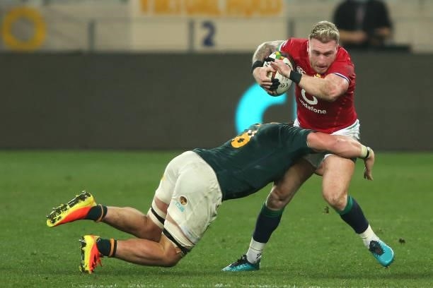 Jasper Wiese of South Africa tackles Stuart Hogg of the British & Irish Lions during the second test between South Africa and the British & Irish...