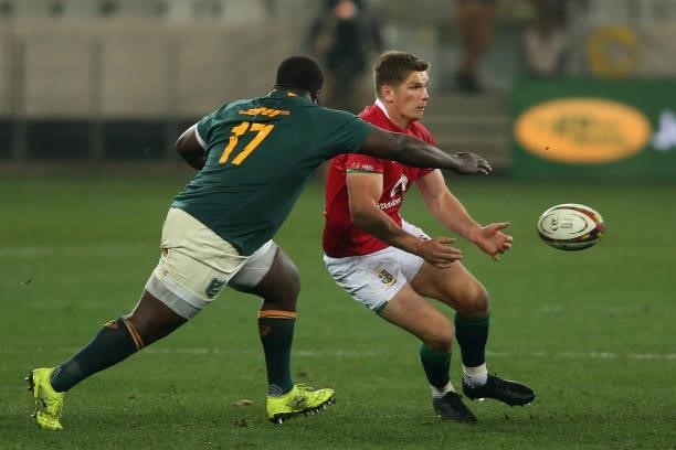 Trevor Nyakane of South Africa closes in as Owen Farrell of the British & Irish Lions gets his pass away during the second test between South Africa...