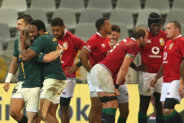 Faf de Klerk of South Africa congratulates Lukhanyo Am for scoring a try during the second test between South Africa and the British & Irish Lions at...
