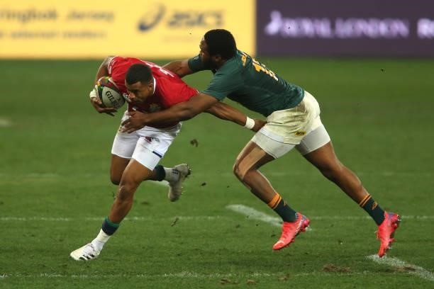 Anthony Watson of the British & Irish Lions attempts to get past Lukhanyo Am of South Africa during the second test between South Africa and the...