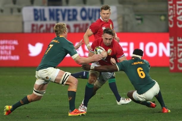 Jack Conan of the British & Irish Lions attempts to get past Pieter-Steph du Toit and South Africa captain Siya Kolisi during the second test between...