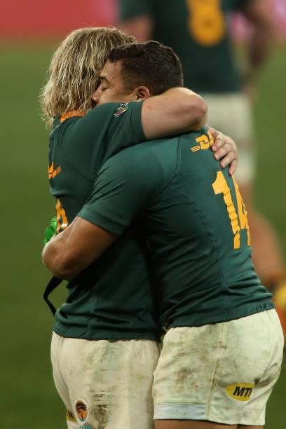 Faf de Klerk of South Africa and Cheslin Kolbe of South Africa celebrate after the final whistle as South Africa beat British & Irish Lions 27-9 at...