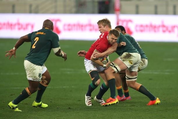 Dan Biggar of the British & Irish Lions is tackled by Pieter-Steph du Toit of South Africa during the second test between South Africa and the...