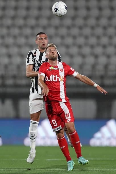 Merih Demiral of Juventus and Christian Gytkjaer of AC Monza focus on the ball during the Trofeo Berlusconi match between AC Monza and Juventus FC at...