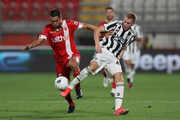 Dejan Kulusevski of Juventus clashes with Giuseppe Bellusci of AC Monza during the Trofeo Berlusconi match between AC Monza and Juventus FC at Stadio...