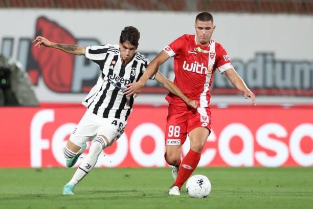 Matias Soule of Juventus clashes with Lorenzo Pirola of AC Monza during the Trofeo Berlusconi match between AC Monza and Juventus FC at Stadio...