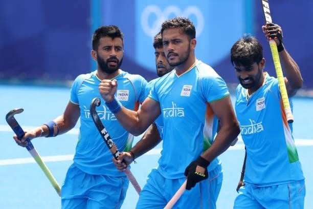 Harmanpreet Singh celebrates scoring the first goal with Sumit and teammates during the Men's Semifinal match between India and Belgium on day eleven...