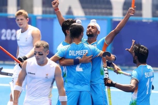 Mandeep Singh of Team India celebrates scoring the second goal with Dilpreet Singh and Sumit during the Men's Semifinal match between India and...