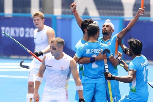 Mandeep Singh of Team India celebrates scoring the second goal with Dilpreet Singh and Sumit during the Men's Semifinal match between India and...