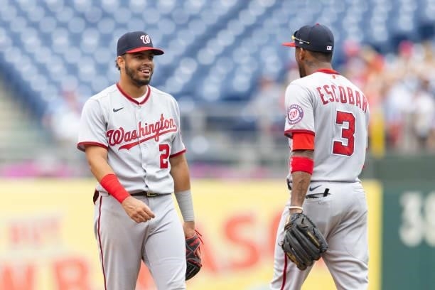 Luis Garcia and Alcides Escobar of the Washington Nationals look on against the Philadelphia Phillies during Game One of the doubleheader at Citizens...