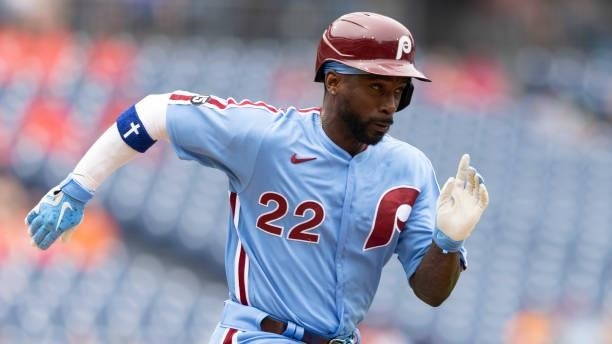 Andrew McCutchen of the Philadelphia Phillies runs to first base against the Washington Nationals during Game One of the doubleheader at Citizens...