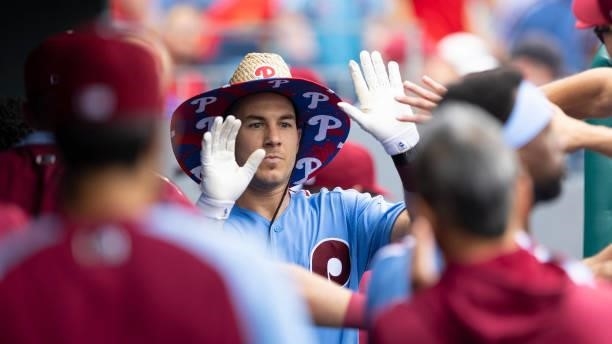 Realmuto of the Philadelphia Phillies high fives his teammates after hitting a solo home run in the bottom of the fourth inning against the...