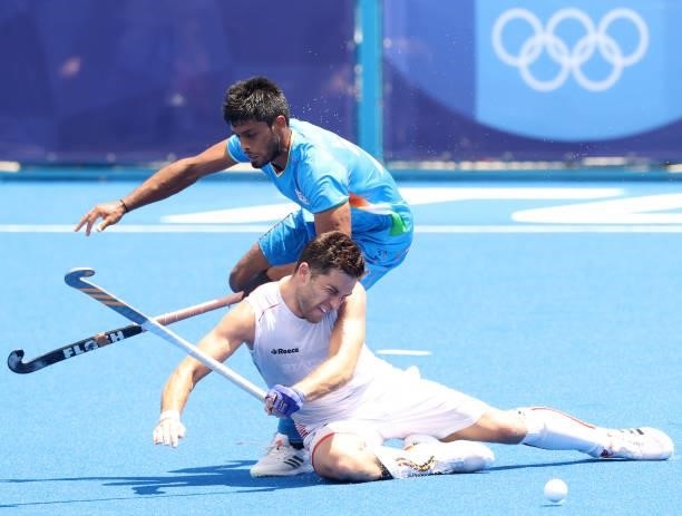 Cedric Daniel Andre Charlier of Team Belgium and Varun Kumar of Team India battle for a loose ball during the Men's Semifinal match between India and...