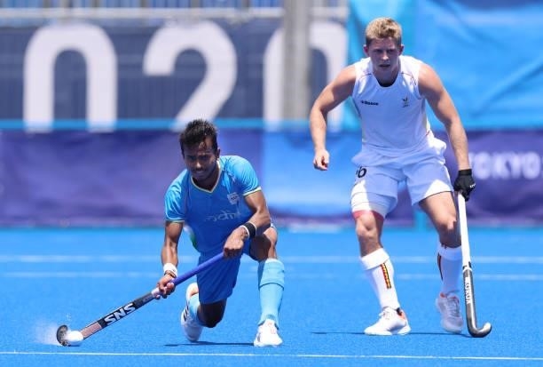 Vivek Sagar Prasad of Team India controls the ball against Victor Nicky B Wegnez of Team Belgium during the Men's Semifinal match between India and...
