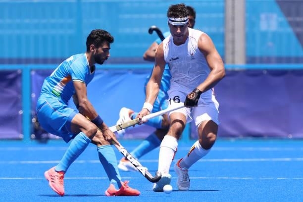 Shamsher Singh of Team India and Alexander Robby P Hendrickx of Team Belgium battle for a loose ball during the Men's Semifinal match between India...