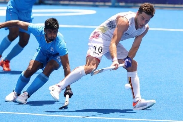Cedric Daniel Andre Charlier of Team Belgium controls the ball against Varun Kumar of Team India during the Men's Semifinal match between India and...