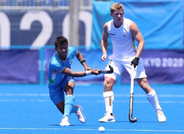 Vivek Sagar Prasad of Team India controls the ball against Victor Nicky B Wegnez of Team Belgium during the Men's Semifinal match between India and...