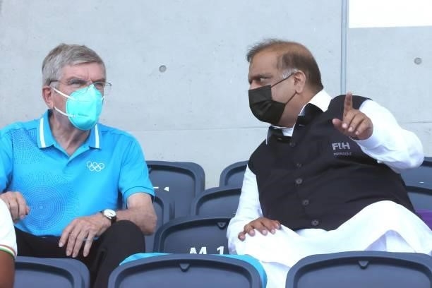 President Thomas Bach and IHF President Narinder Dhruv Batra look on during the Men's Semifinal match between India and Belgium on day eleven of the...