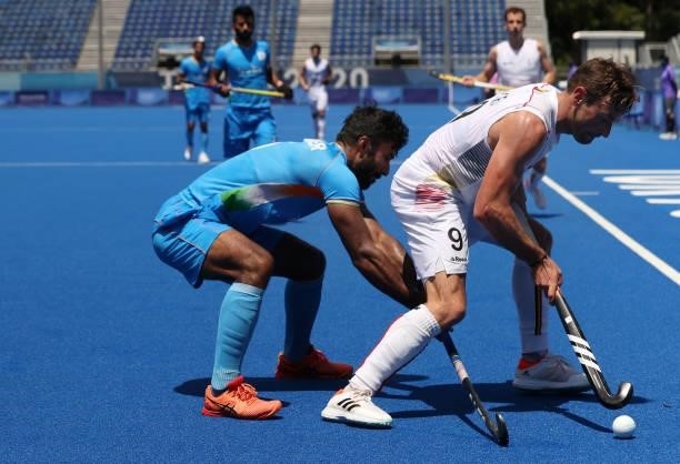Sebastien Dockier of Team Belgium controls the ball against Surender Kumar of Team India during the Men's Semifinal match between India and Belgium...