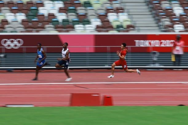 Eseosa Fostine Desalu of Italy, Nethaneel Mitchell-Blake of Great Britain and Xie Zhenye of China compete in Men's 200m Round 1 - Heat 6 on day...