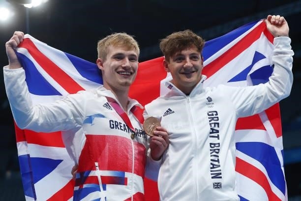 Bronze medalist Jack Laugher of Team Great Britain poses with his coach Adam Smallwood after the medal ceremony for the Men's 3m Springboard Final on...