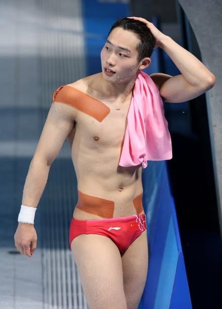 Wang Zongyuan of Team China reacts after his final dive in the Men's 3m Springboard Final on day eleven of the Tokyo 2020 Olympic Games at Tokyo...