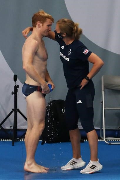 James Heatly of Team Great Britain celebrates with his coach after his final dive in the Men's 3m Springboard Final on day eleven of the Tokyo 2020...