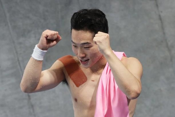 Wang Zongyuan of Team China reacts after his final dive in the Men's 3m Springboard Final on day eleven of the Tokyo 2020 Olympic Games at Tokyo...