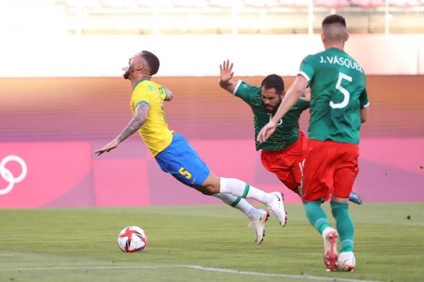 Luiz Douglas of Team Brazil is fouled by Joaquin Esquivel of Team Mexico which leads to a penalty being awarded however is later reversed via a VAR...
