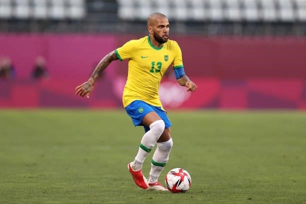 Dani Alves of Team Brazil runs with the ball during the Men's Football Semi-final match between Mexico and Brazil on day eleven of the Tokyo 2020...