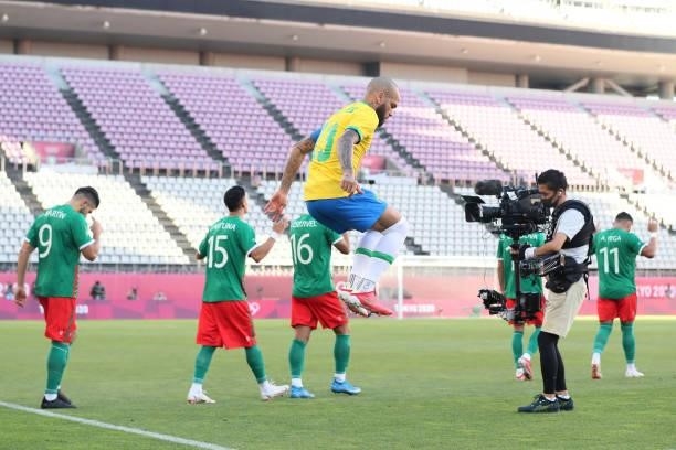 Dani Alves of Team Brazil jumps as they enter the pitch prior to the Men's Football Semi-final match between Mexico and Brazil on day eleven of the...
