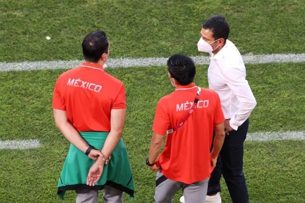 Jaime Lozano, Head Coach of Team Mexico interacts with members of his coaching staff during the Men's Football Semi-final match between Mexico and...
