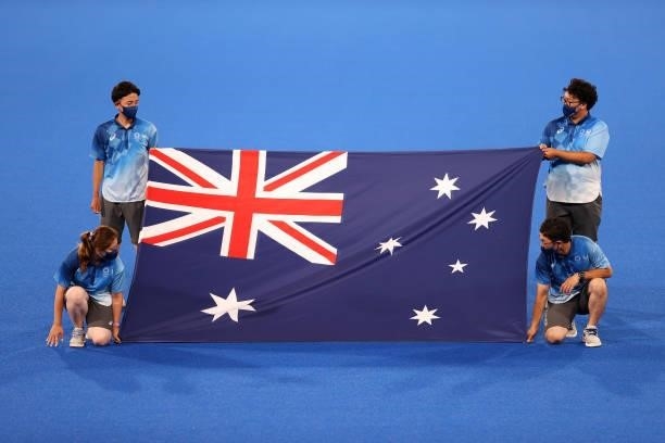 Flag bearers hold the flag of Team Australia ahead of the Men's Semifinal match between Australia and Germany on day eleven of the Tokyo 2020 Olympic...