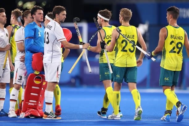 Tobias Constantin Hauke of Team Germany interacts with Team Australia prior to the Men's Semifinal match between Australia and Germany on day eleven...