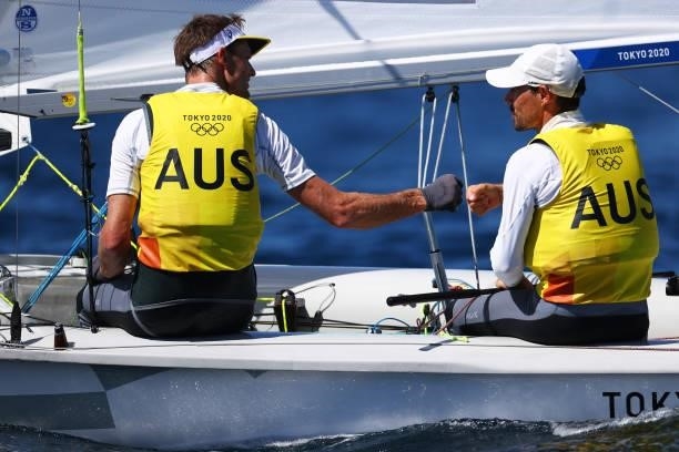 Mathew Belcher and Will Ryan of Team Australia react following the Men's 470 class on day eleven of the Tokyo 2020 Olympic Games at Enoshima Yacht...